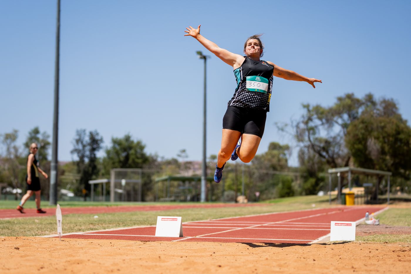 A competitor during the long jump at a previous Games
